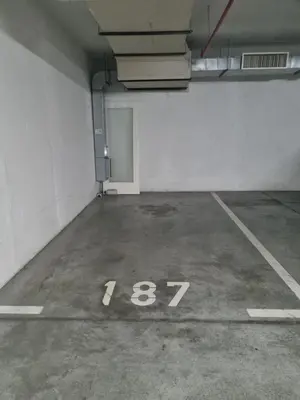 an empty parking lot with the number in a parking garage at Laguna in Bežanija