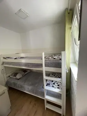 a bedroom with two bunk beds in a room at Travel Home in Belgrade