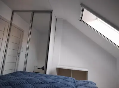 a bedroom with a bed and a mirror at Miki Private Room in Belgrade