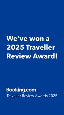 a blue sign that says weve won a traveler review award at Apartman Lela in Belgrade