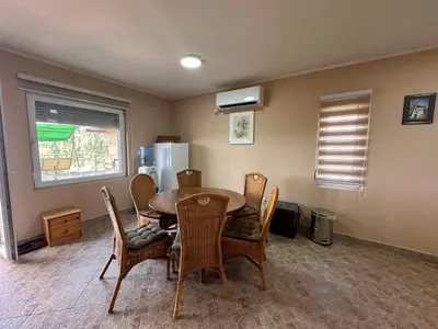a dining room with a table and chairs at Villa Popovic - apartments Fruska gora in Sremski Karlovci