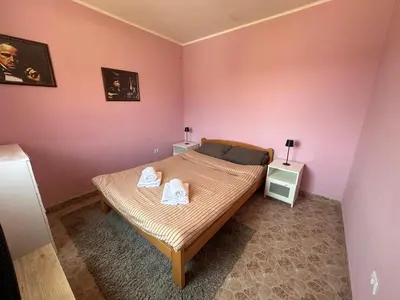 a bedroom with a bed with two towels on it at Villa Popovic - apartments Fruska gora in Sremski Karlovci