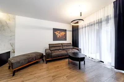 a living room with a couch and a table at Dark Nest 2 Belgrade Apartments in Belgrade