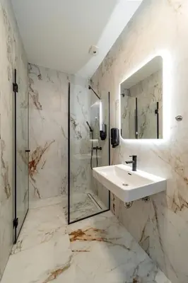 a white bathroom with a sink and a shower at Dark Nest 2 Belgrade Apartments in Belgrade
