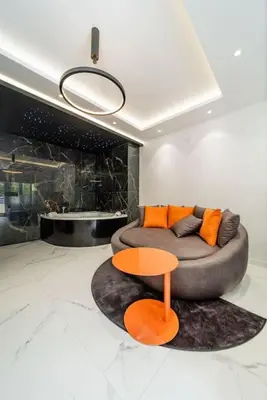 a living room with a couch and a table at Zebrano Spa in Novi Beograd