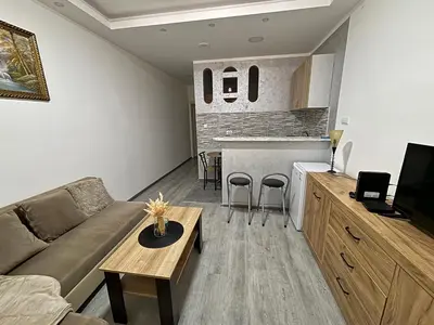a living room with a couch and a table at Apartment DD in Belgrade