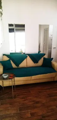 a couch with pillows on it in a room at Cradle of Love in Belgrade