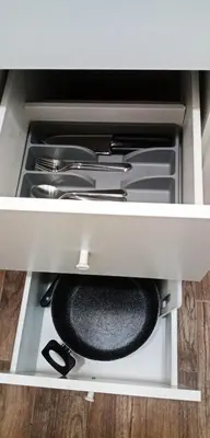 a drawer filled with utensils in a cabinet at Cradle of Love in Belgrade