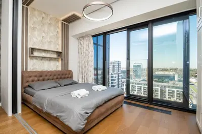 a bedroom with a bed with two towels at West Kula 14 in Belgrade
