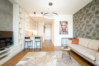a living room with a couch and a kitchen at West Kula 14 in Belgrade