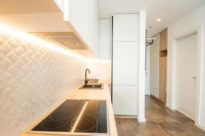 a kitchen with a sink in the middle of a room at West Kula 14 in Belgrade