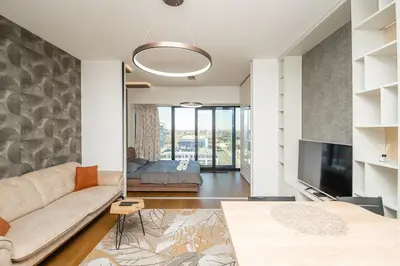 a living room with a couch and a tv at West Kula 14 in Belgrade