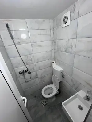 a bathroom with a toilet and a sink at RiverScapeMoments Studio in Belgrade
