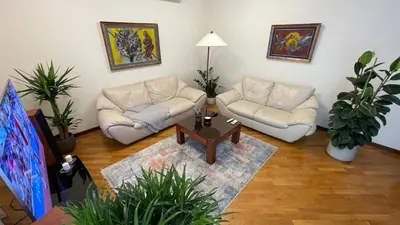 a living room with two couches and a coffee table at Top secret 24 in Belgrade