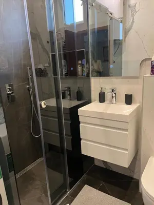 a bathroom with a shower and a sink at Top secret 24 in Belgrade