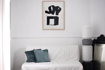 a white couch with a pillow on it in a living room at Tasmajdan in Belgrade