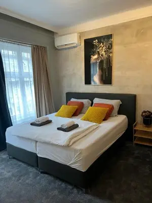 a bedroom with a large bed with towels on it at Apartment Moka in Belgrade