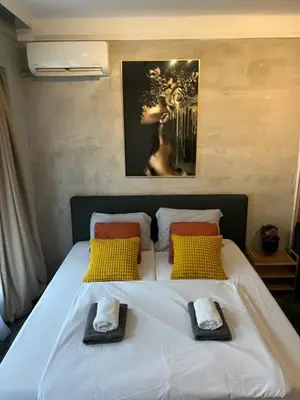 a bedroom with a bed with two towels on it at Apartment Moka in Belgrade