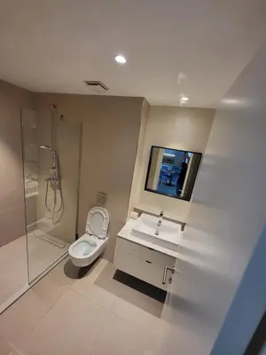 a bathroom with a toilet and a sink and a shower at BW Waterfront LUX apartment, parking free in Sajmište