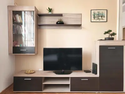 a flat screen tv sitting on top of a entertainment center at Parliament City Centre PROMO PRICE in Belgrade
