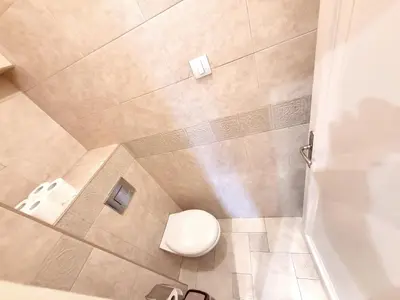 a bathroom with a toilet and a shower at Parliament City Centre PROMO PRICE in Belgrade