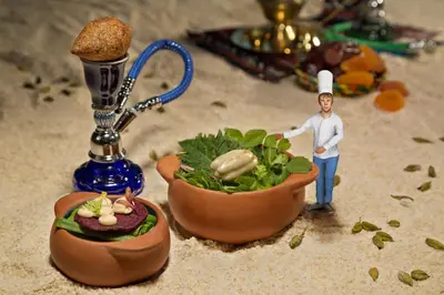 a figurine of a chef standing next to a bowl of food at Lumière Hotel Pool & SPA in Belgrade