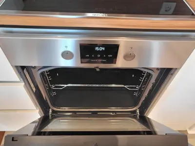 a close up of an oven with a clock on it at Panoramic View Premium Apartment BW in Belgrade