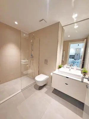 a bathroom with a toilet and a sink and a shower at Panoramic View Premium Apartment BW in Belgrade