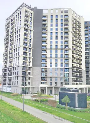 a large apartment building with a street in front of it at Belgrade Waterfront PROMO PRICE in Belgrade
