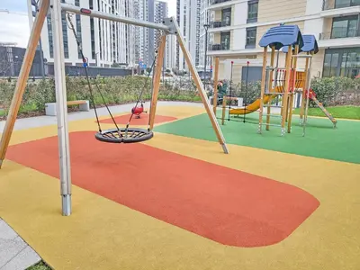 a playground with two swings and a slide at Belgrade Waterfront PROMO PRICE in Belgrade