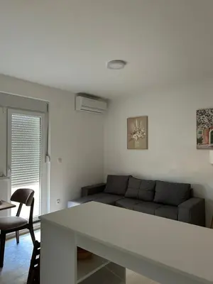 a living room with a couch and a table at Apartman Lola in Novi Grad
