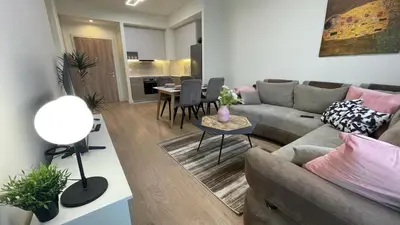 a living room with a couch and a table at Scala BW in Sajmište