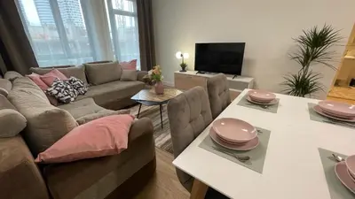 a living room with a couch and a table at Scala BW in Sajmište