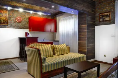 a living room with a couch and a table at Studio 600 in Belgrade