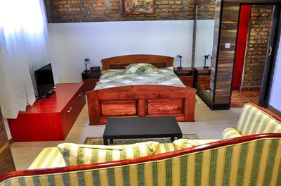 a living room with a bed and a couch at Studio 600 in Belgrade