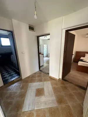 an empty room with a bedroom and a bed at BIRDS apartmani in Belgrade