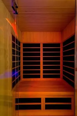 a room with a sauna with wooden shelves and a light at Boom Spa 1 Belgrade Apartments in Fontana