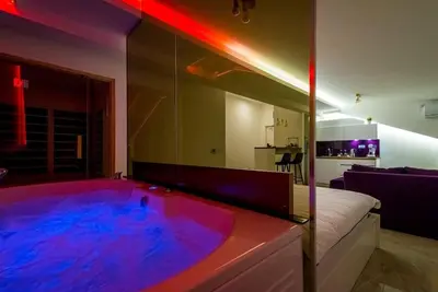 a bathroom with a hot tub in a room at Boom Spa 1 Belgrade Apartments in Fontana