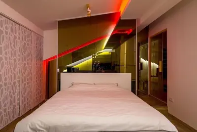 a bedroom with a white bed in a room at Boom Spa 1 Belgrade Apartments in Fontana