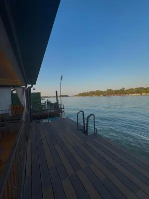 a dock on a river with the water at Santa Barbara River in Belgrade