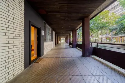 an empty hallway of a building with a ceiling at Rodman Belgrade Apartment in Novi Beograd