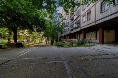 an empty street in front of a building at Rodman Belgrade Apartment in Novi Beograd