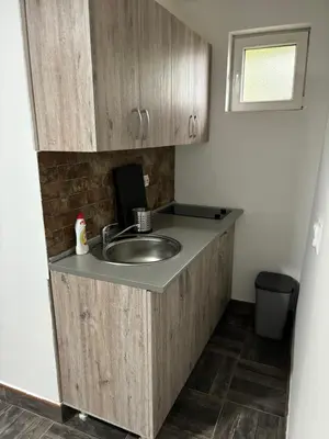 a bathroom with a sink and a counter at Kućica u pesku in Novi Vladimirovac