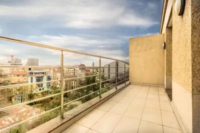 a balcony with a view of the city at Feel Belgrade Apartments in Belgrade