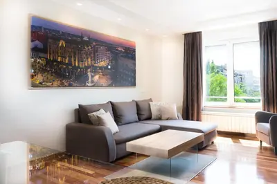 a living room with a couch and a table at Feel Belgrade Apartments in Belgrade