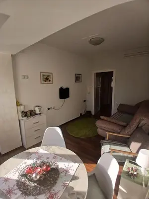 a living room with a couch and a table at Nada Sweet House in Belgrade