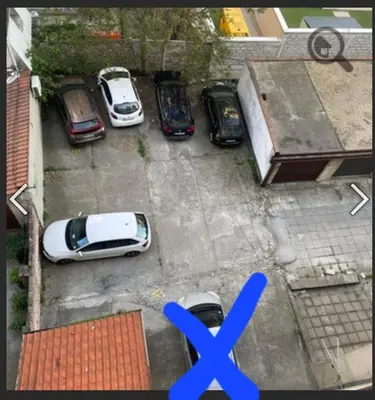 a group of cars parked in a parking lot at Nada Sweet House in Belgrade
