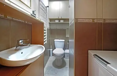 a bathroom with a sink and a toilet at Cozy apartment near Saint Sava Temple in Belgrade