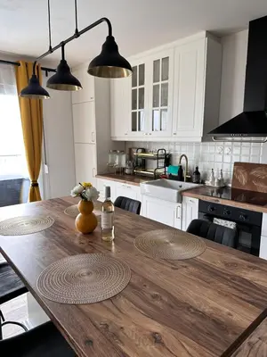 a kitchen with a wooden table in a kitchen at Vila Vista Verde in Zaklopača