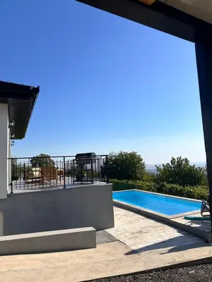 a view of a swimming pool from a house at Vila Vista Verde in Zaklopača